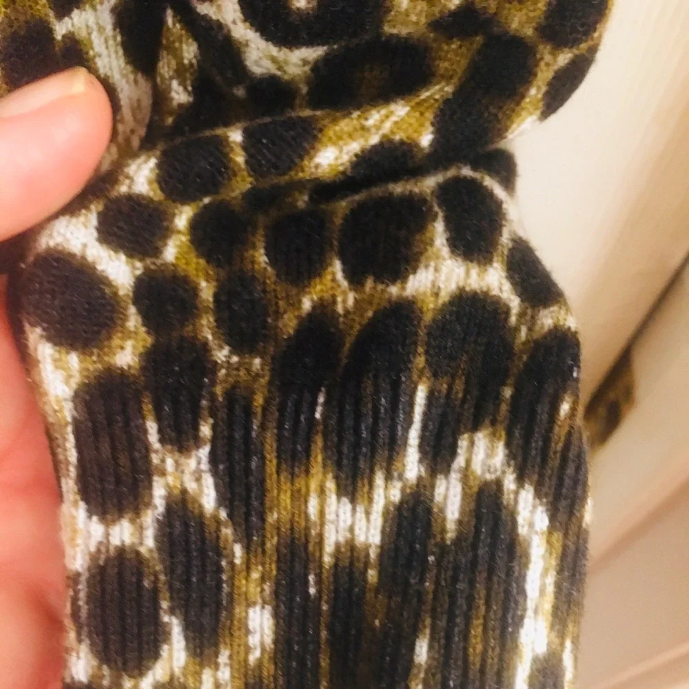 Mk sweater over size will fit a med. cheetha p